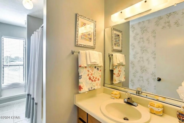 bathroom with vanity and tile patterned flooring