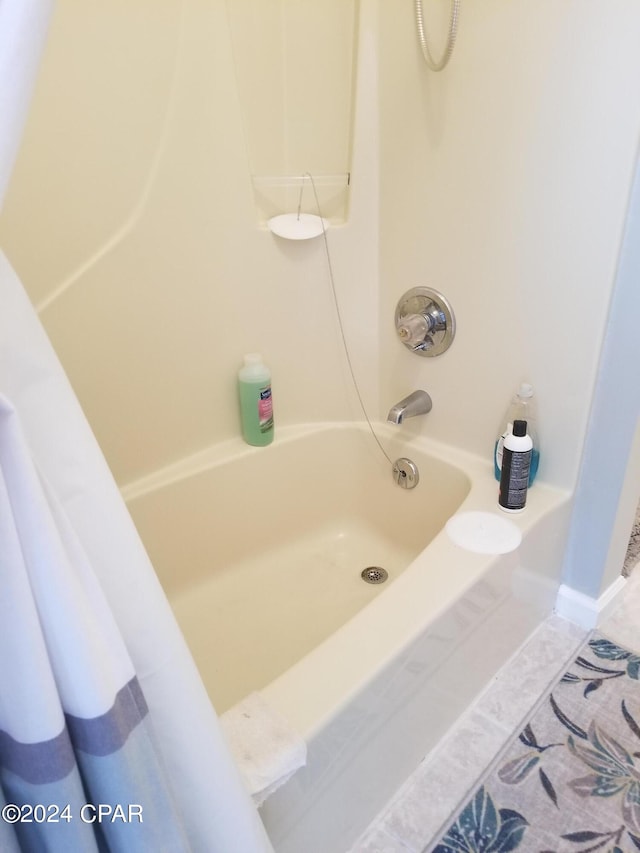 bathroom featuring shower / tub combo and tile patterned floors