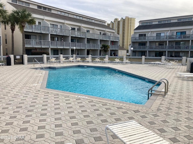 view of swimming pool featuring central air condition unit