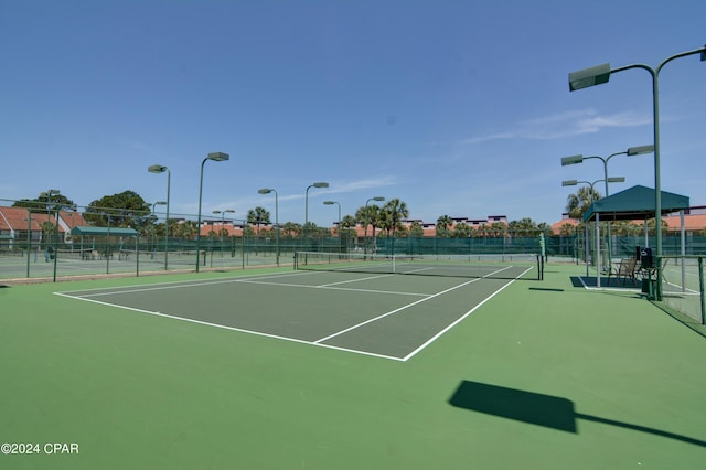 view of sport court with basketball hoop