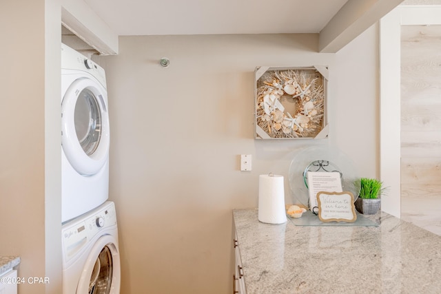 washroom with stacked washer / dryer