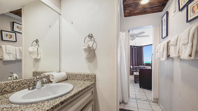 bathroom featuring wood ceiling, tile floors, ceiling fan, and large vanity