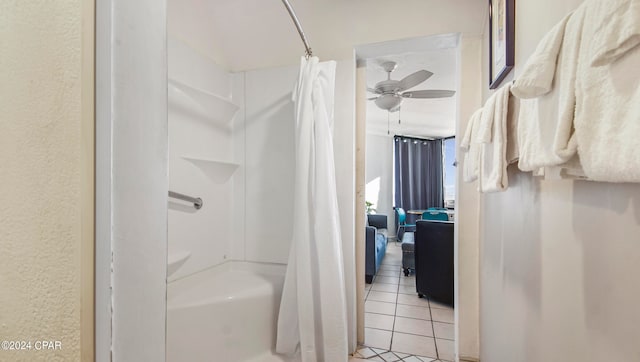 bathroom featuring tile flooring, shower / bath combo with shower curtain, and ceiling fan