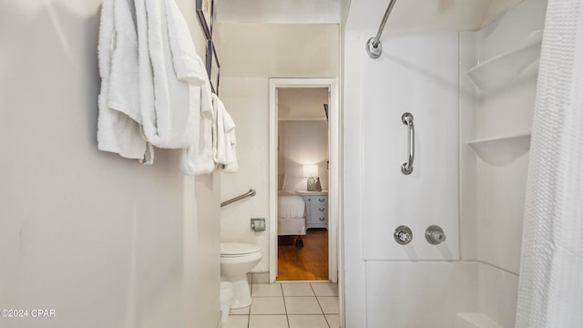 bathroom with toilet and tile flooring