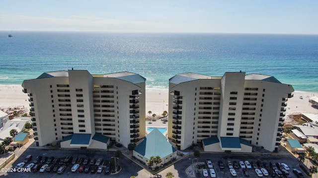 bird's eye view with a view of the beach and a water view