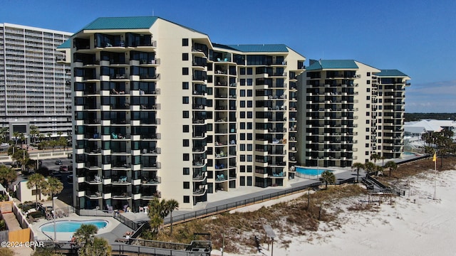 view of property featuring a community pool