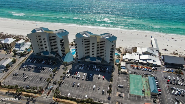 birds eye view of property featuring a view of the beach and a water view