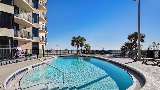 view of swimming pool with a patio area