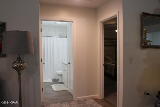 bathroom with hardwood / wood-style flooring