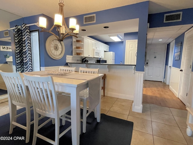 dining room featuring light tile patterned floors