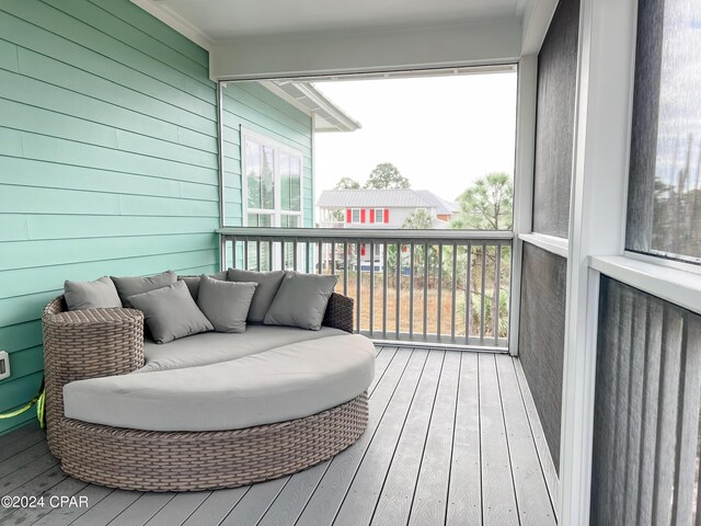 bedroom with crown molding and access to exterior