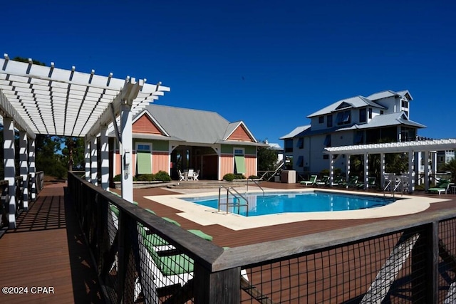 view of pool with a patio and a pergola