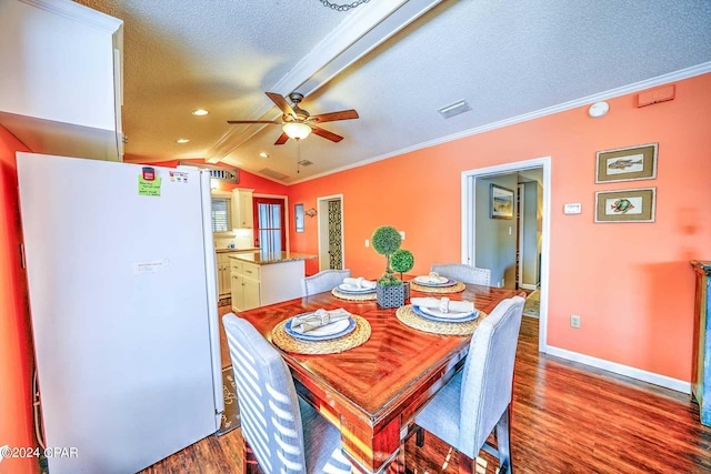 dining space featuring dark hardwood / wood-style flooring, a textured ceiling, ceiling fan, and lofted ceiling