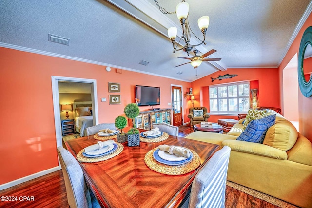 dining space featuring ceiling fan with notable chandelier, dark hardwood / wood-style flooring, and ornamental molding