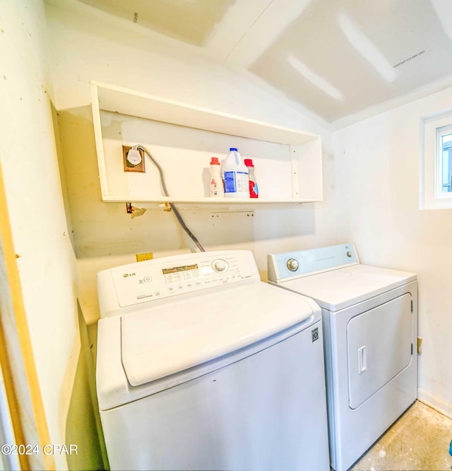 laundry area featuring washing machine and clothes dryer