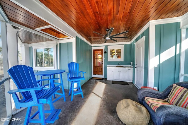 view of patio featuring ceiling fan and sink