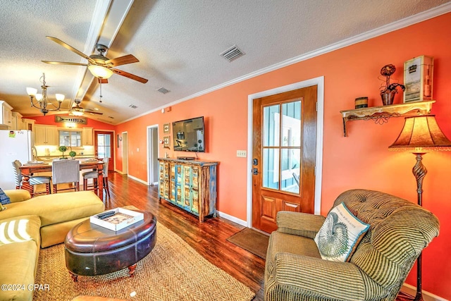 living room with dark hardwood / wood-style flooring, ornamental molding, a textured ceiling, ceiling fan with notable chandelier, and vaulted ceiling with beams