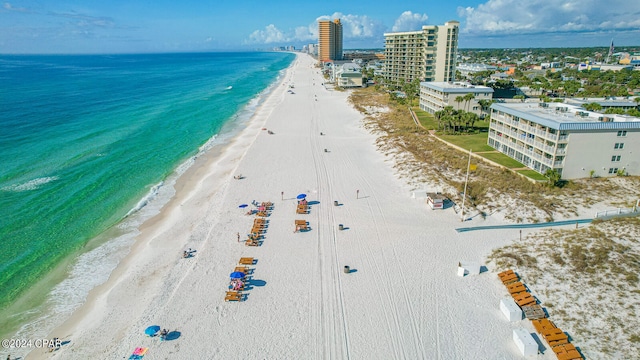 bird's eye view featuring a water view and a view of the beach