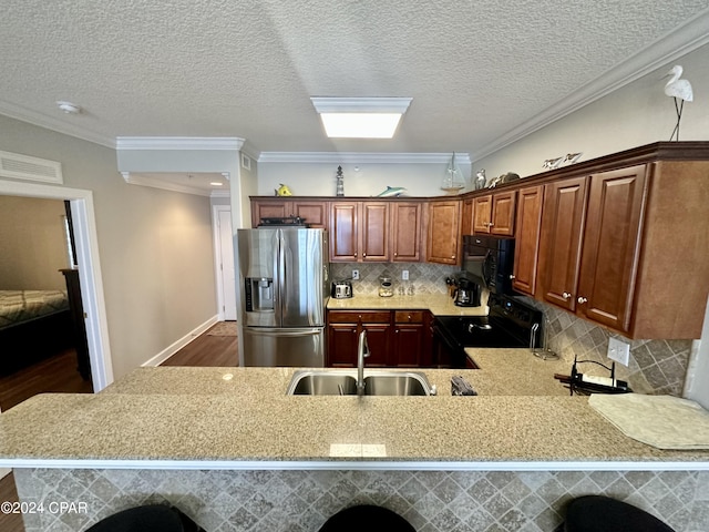 kitchen with dark hardwood / wood-style floors, tasteful backsplash, range with electric cooktop, and stainless steel fridge with ice dispenser