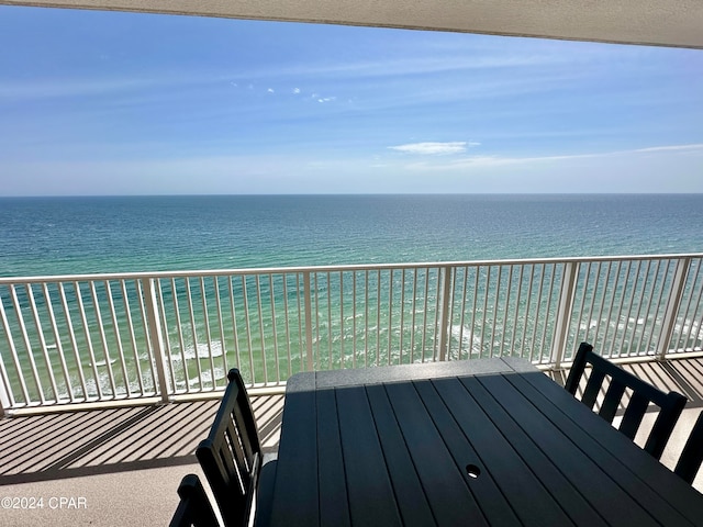 balcony featuring a water view