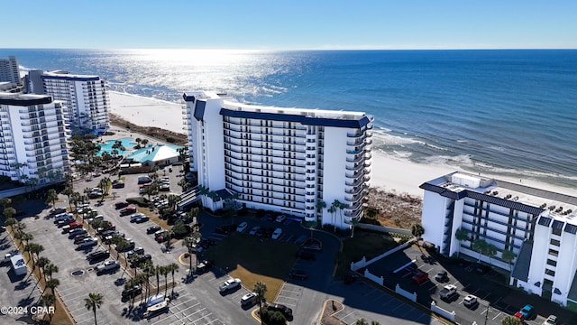 drone / aerial view with a water view and a view of the beach