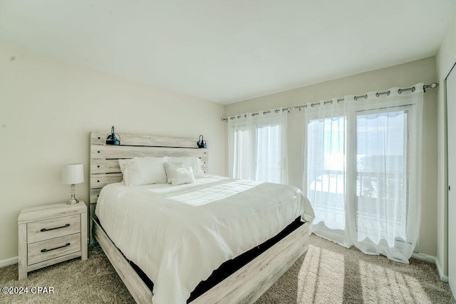 carpeted bedroom featuring access to exterior