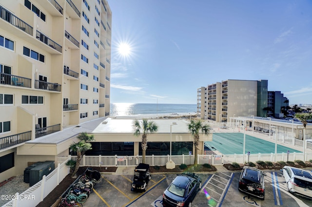 exterior space featuring a water view and a community pool