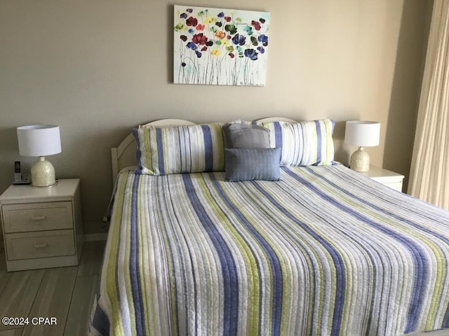 bedroom featuring wood-type flooring