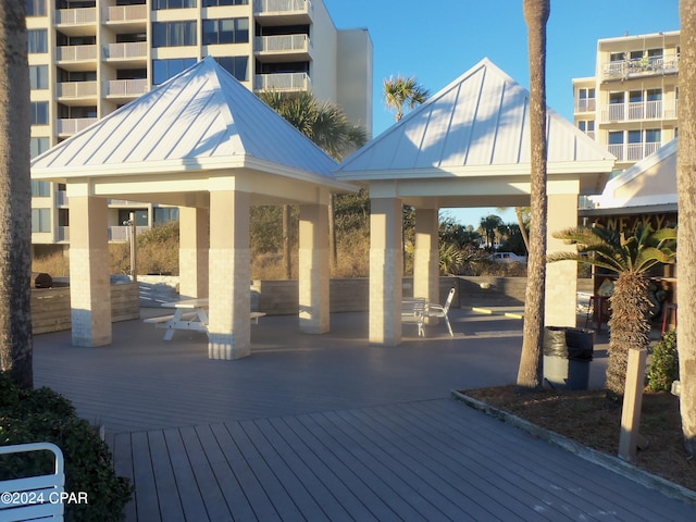 wooden terrace featuring a gazebo