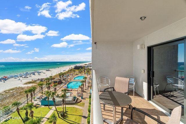 balcony with a view of the beach and a water view