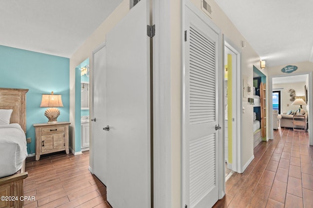 hall with light hardwood / wood-style flooring