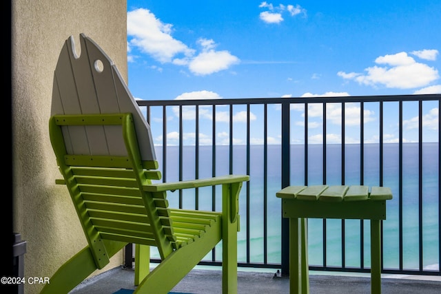 balcony featuring a water view