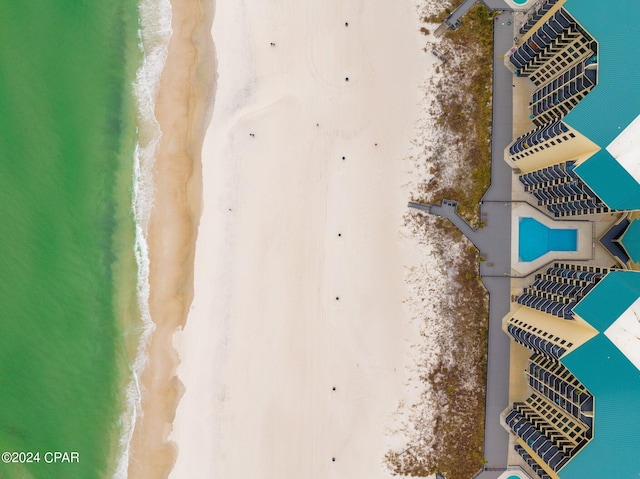 exterior space featuring a view of the beach and a water view