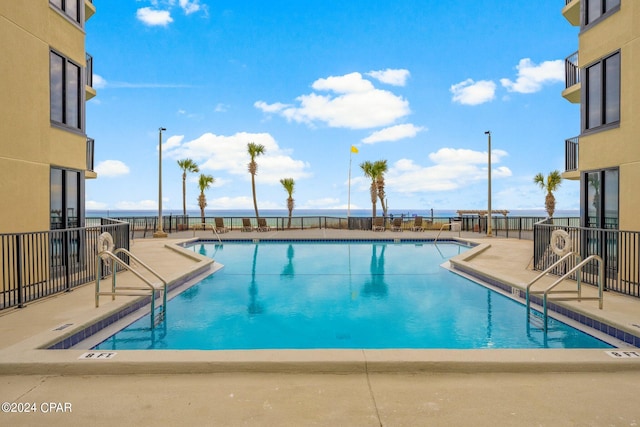 view of swimming pool featuring a patio