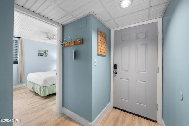 entryway with ceiling fan and light hardwood / wood-style flooring