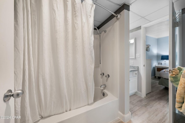 bathroom featuring shower / tub combo, vanity, a paneled ceiling, and hardwood / wood-style floors