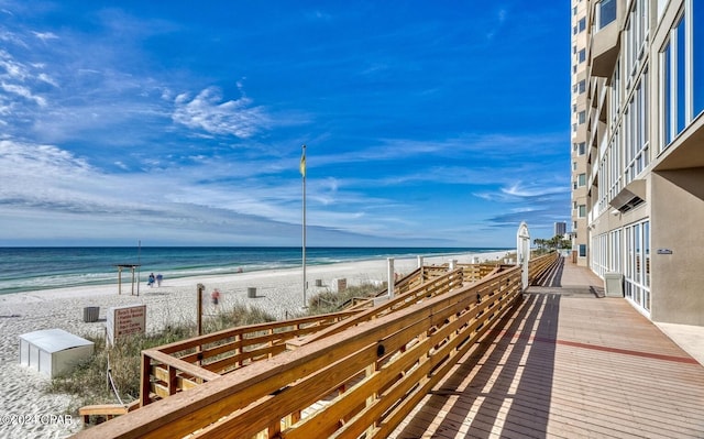 exterior space featuring a view of the beach and a water view