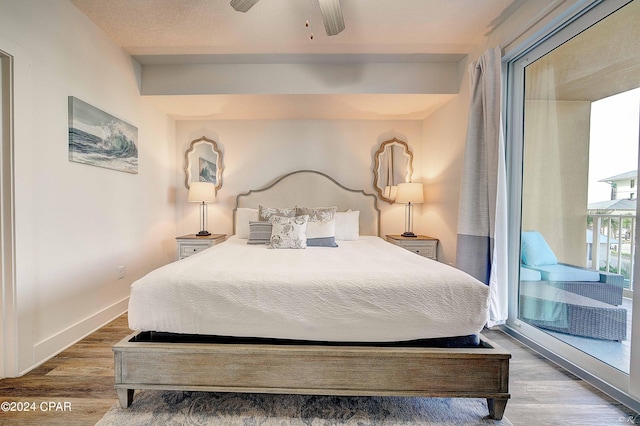 bedroom featuring hardwood / wood-style floors, ceiling fan, and access to outside