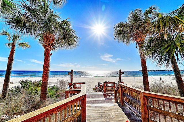 view of nearby features with a beach view and a water view