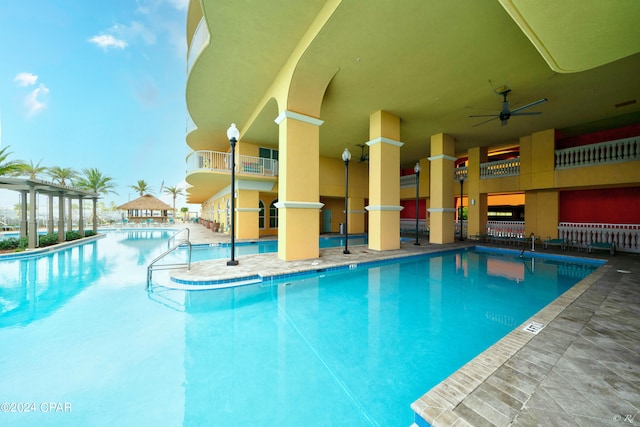 view of swimming pool with ceiling fan