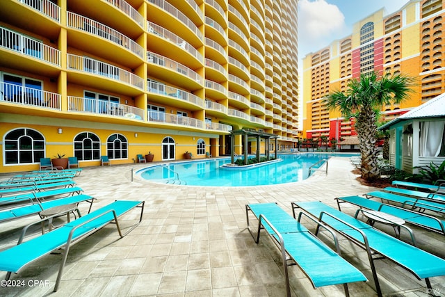 view of swimming pool with a patio area