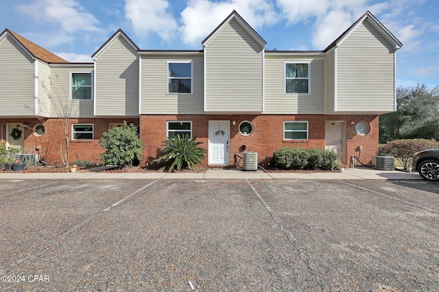 townhome / multi-family property featuring central AC