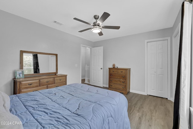 bedroom featuring ceiling fan and light hardwood / wood-style flooring