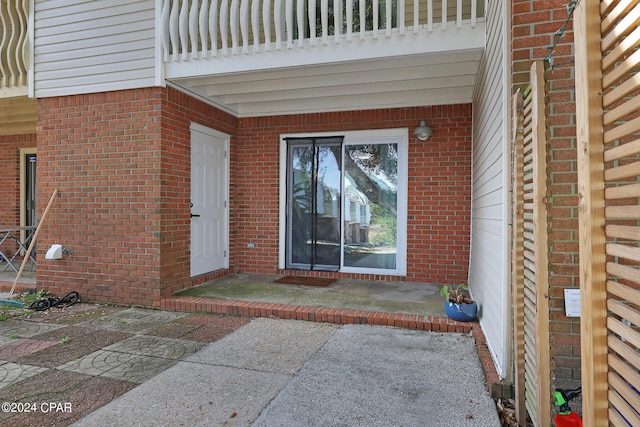 property entrance featuring a patio area