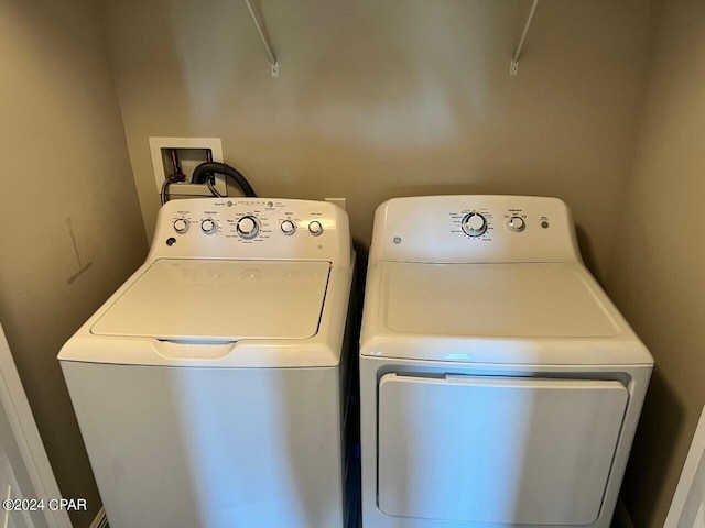 washroom with hookup for a washing machine and washer and dryer