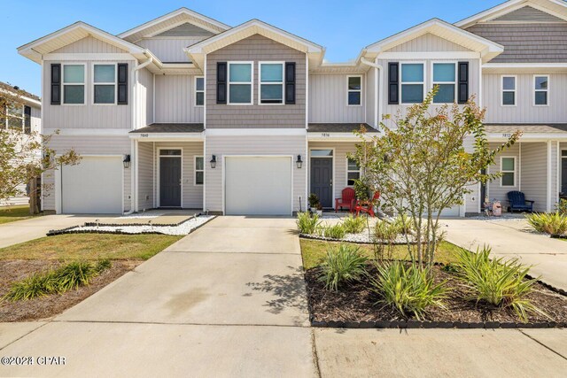 townhome / multi-family property featuring a garage