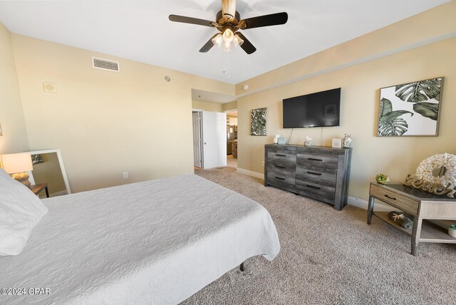 bedroom with visible vents, carpet flooring, baseboards, and ceiling fan