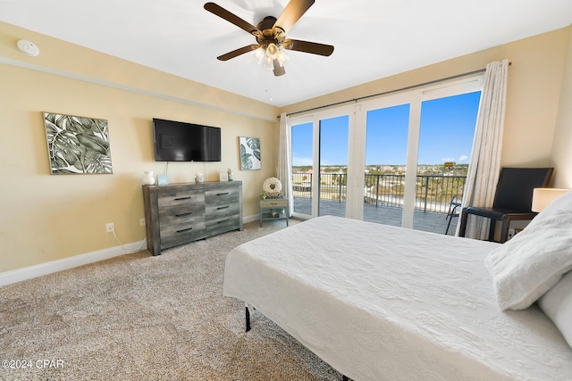 bedroom with ceiling fan, baseboards, carpet floors, and access to exterior