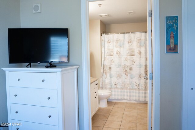 bathroom with vanity, tile flooring, and toilet