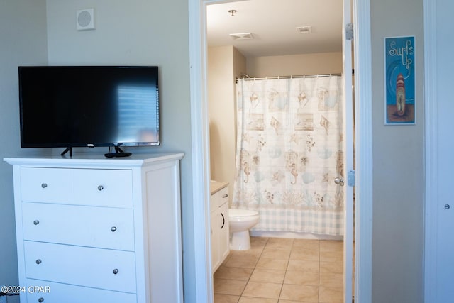 bathroom featuring tile patterned floors, visible vents, toilet, and vanity